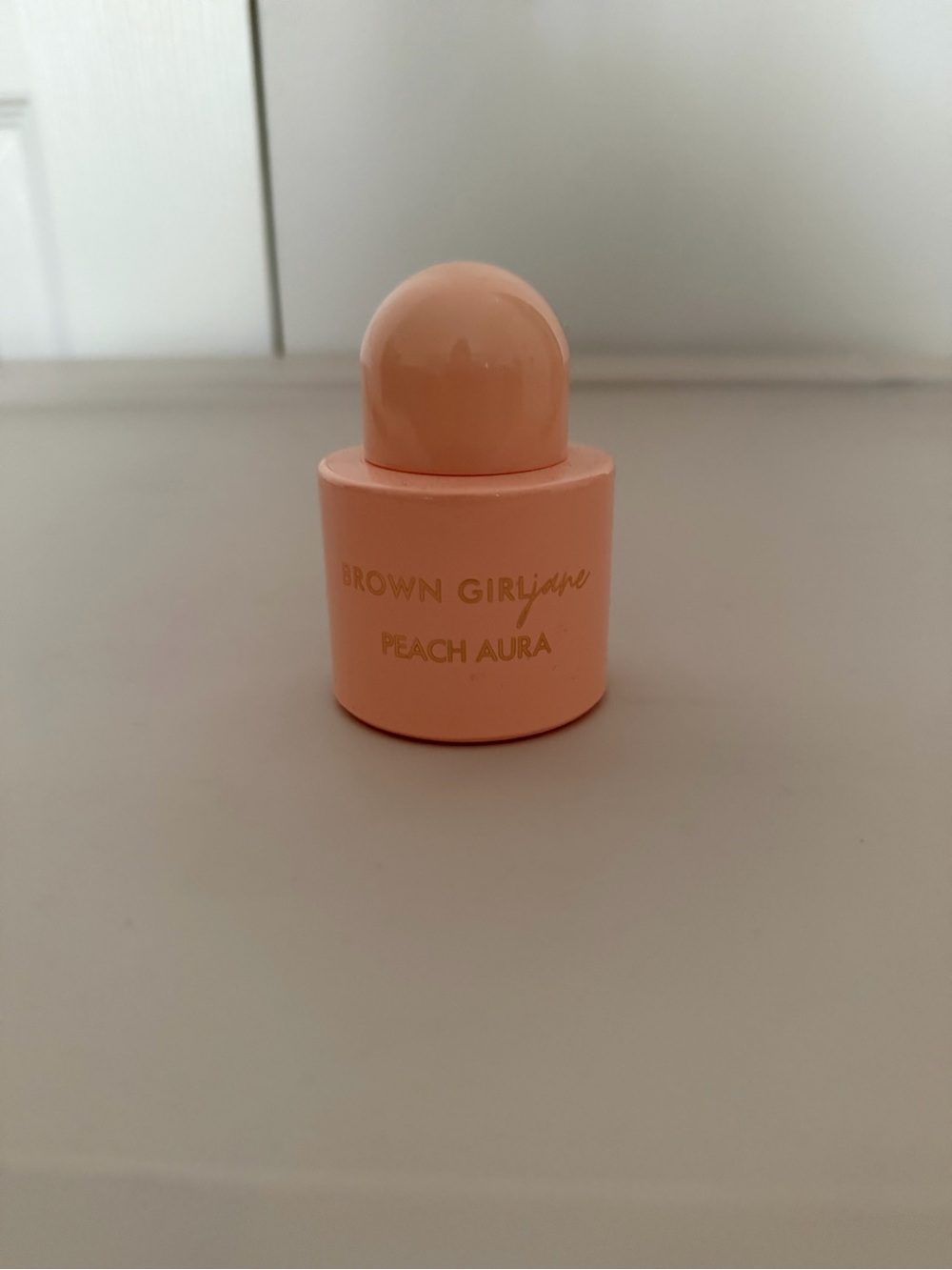 Brown girl Jane peach Aura 1.7 oz